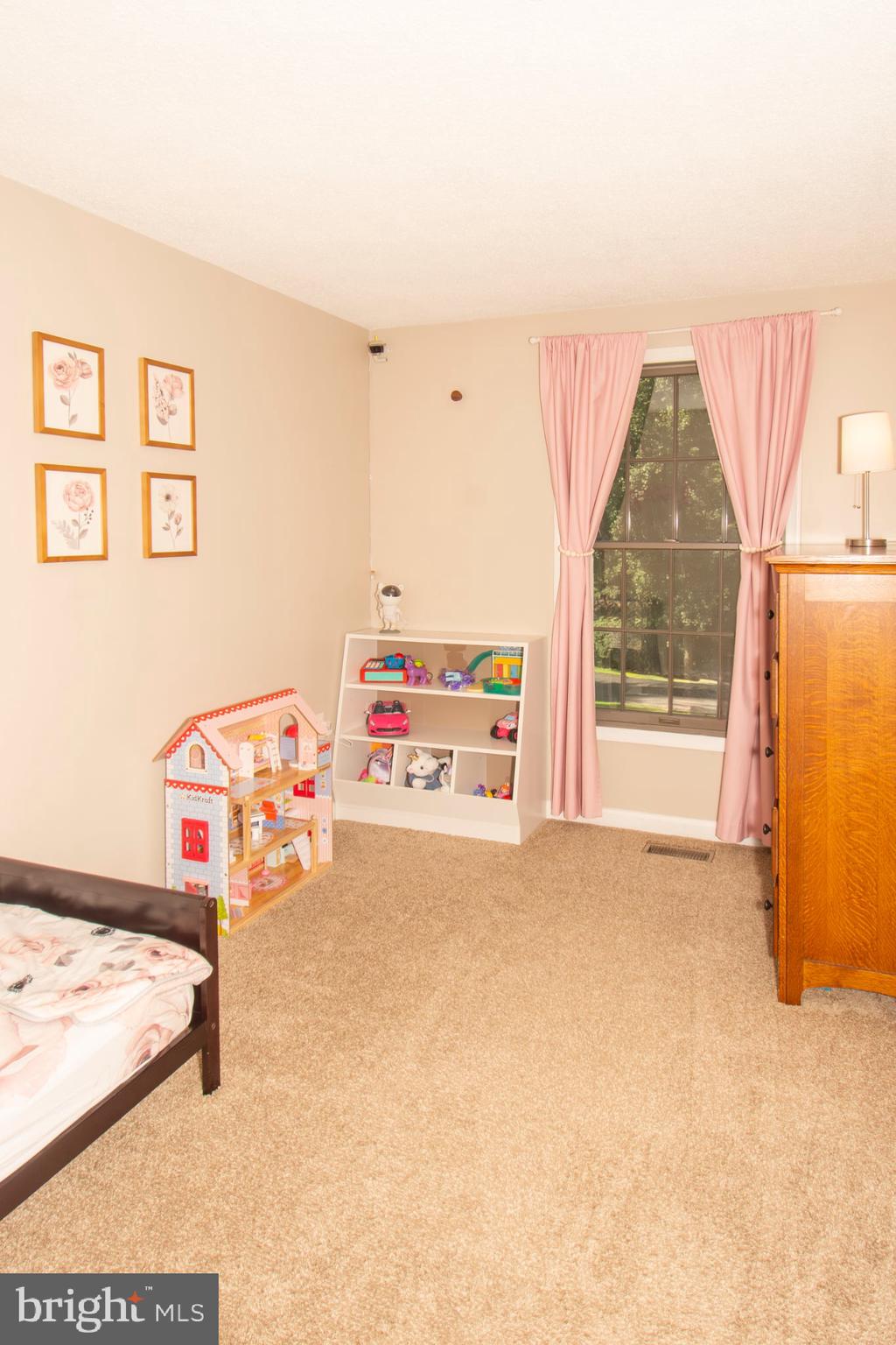 185 Codjus Drive Rising Sun, MD 21911 - Photo 13 of 17 a bedroom with a bed and a window