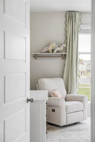 a view of a bedroom with furniture and windows