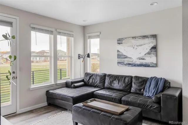 a living room with a couch and a large window