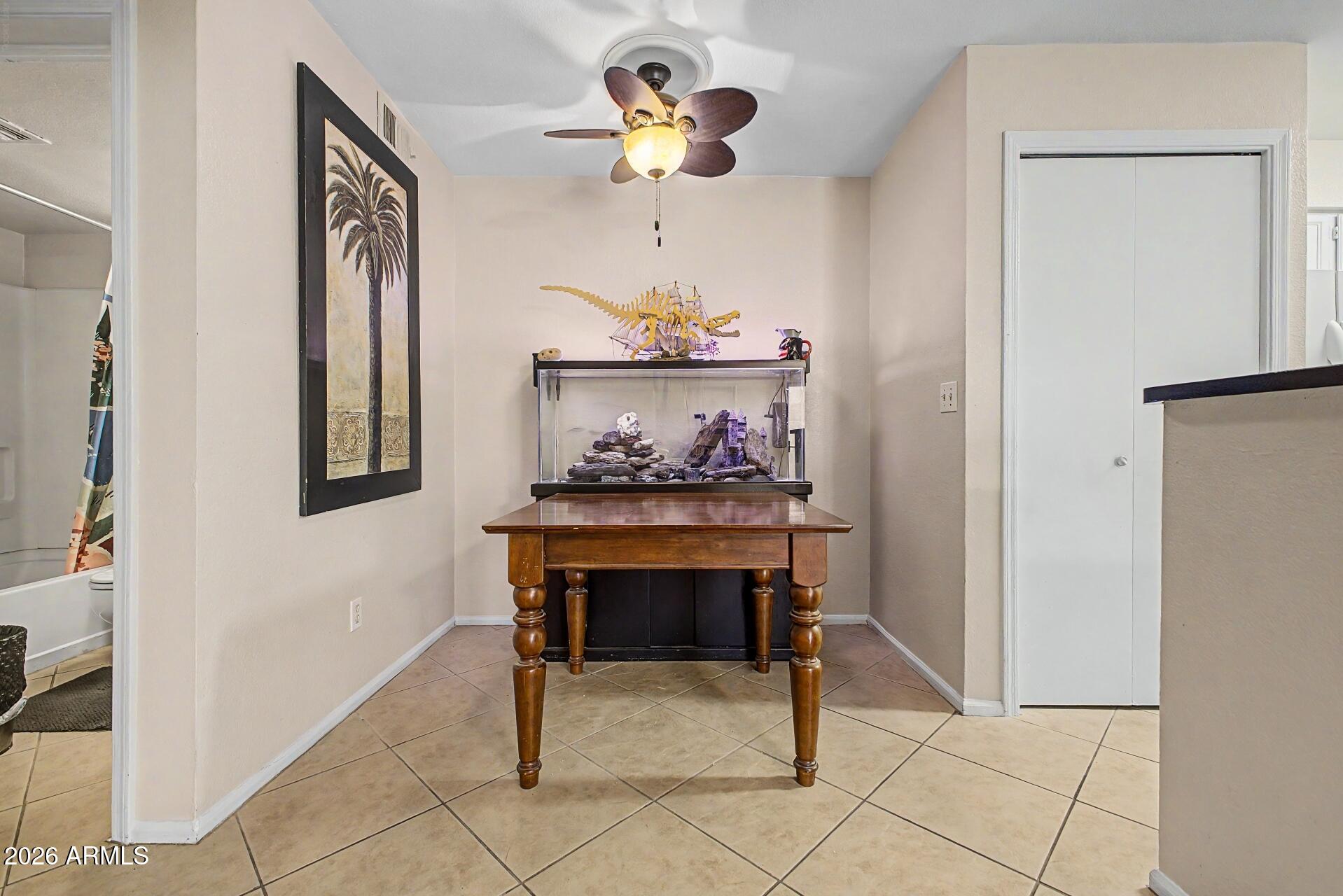 533 West Guadalupe Road, Unit 1104 Mesa, AZ 85210 - Photo 9 of 20 a dining room table chair and chandelier