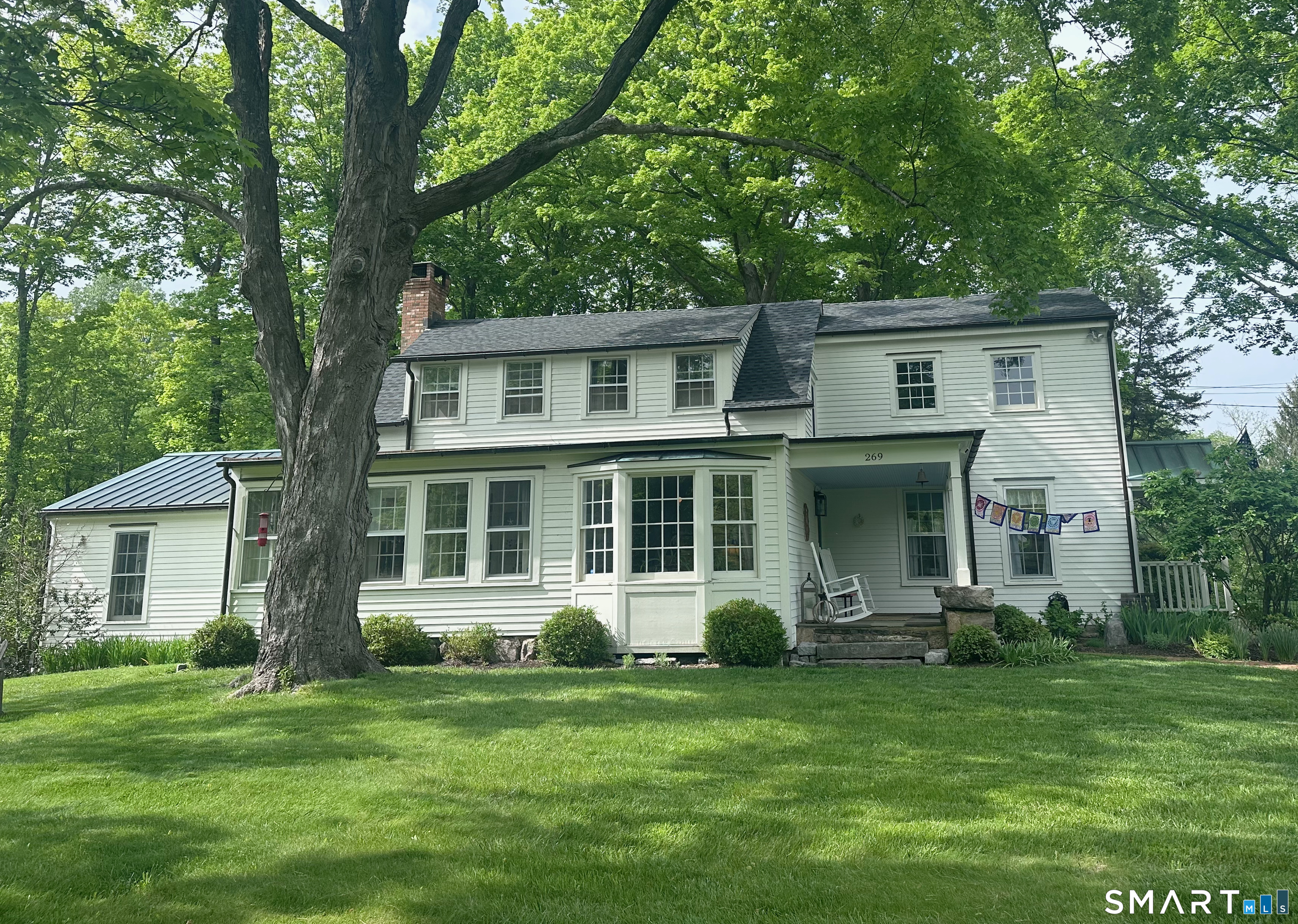 269 Farmingville Road Ridgefield, CT 06877 - Photo 1 of 17 front view of a house with a garden