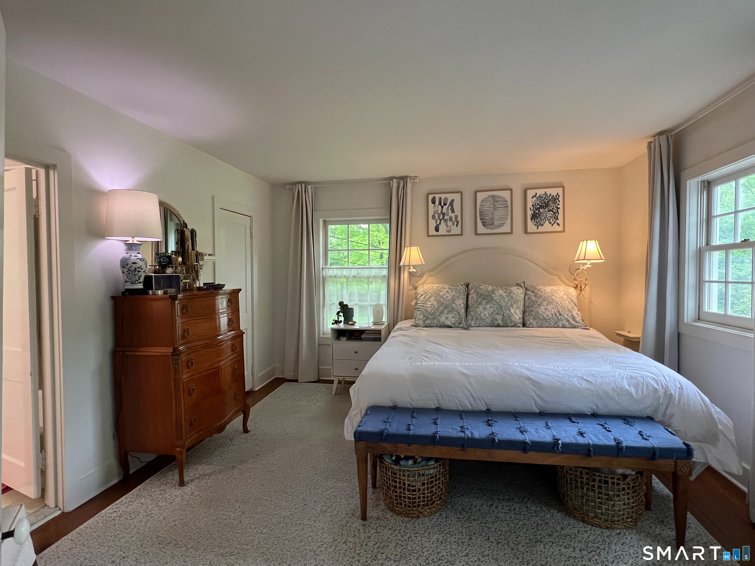 269 Farmingville Road Ridgefield, CT 06877 - Photo 11 of 17 a bedroom with a bed and wooden floor