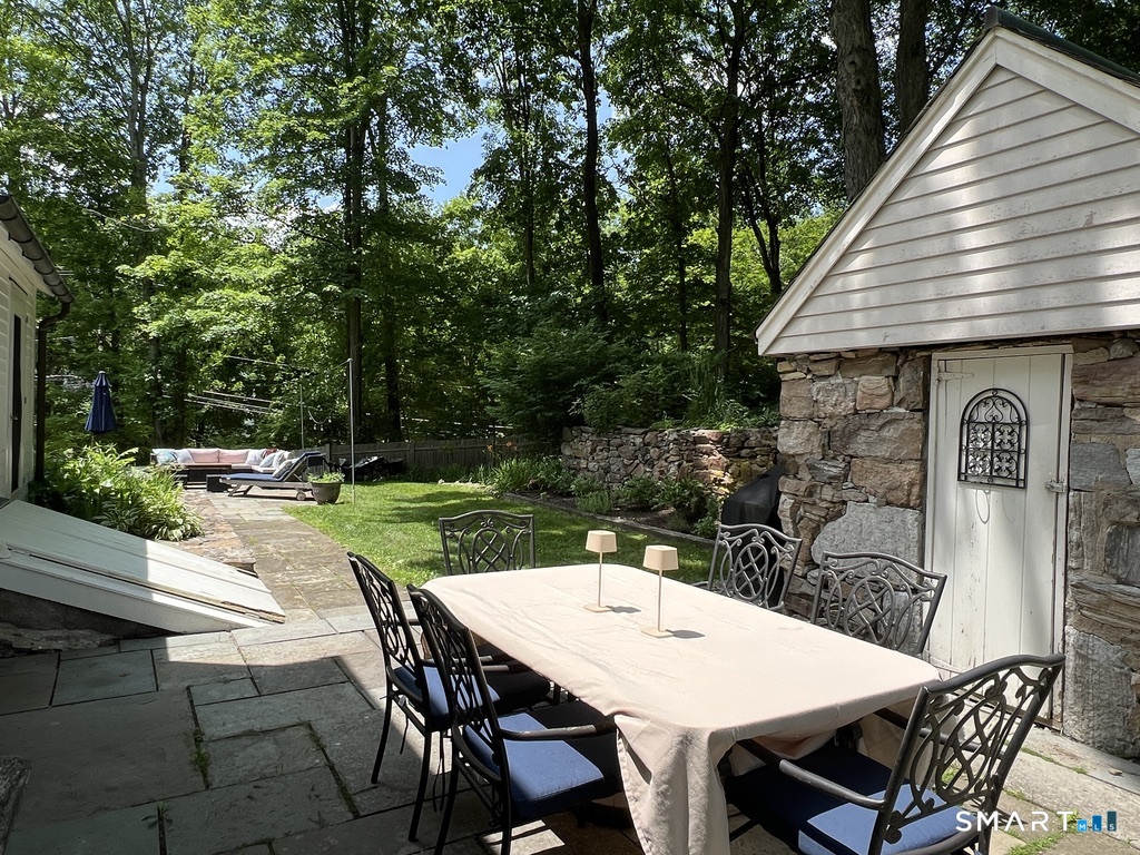 269 Farmingville Road Ridgefield, CT 06877 - Photo 14 of 17 a view of a patio with table and chairs a barbeque with a table and chairs