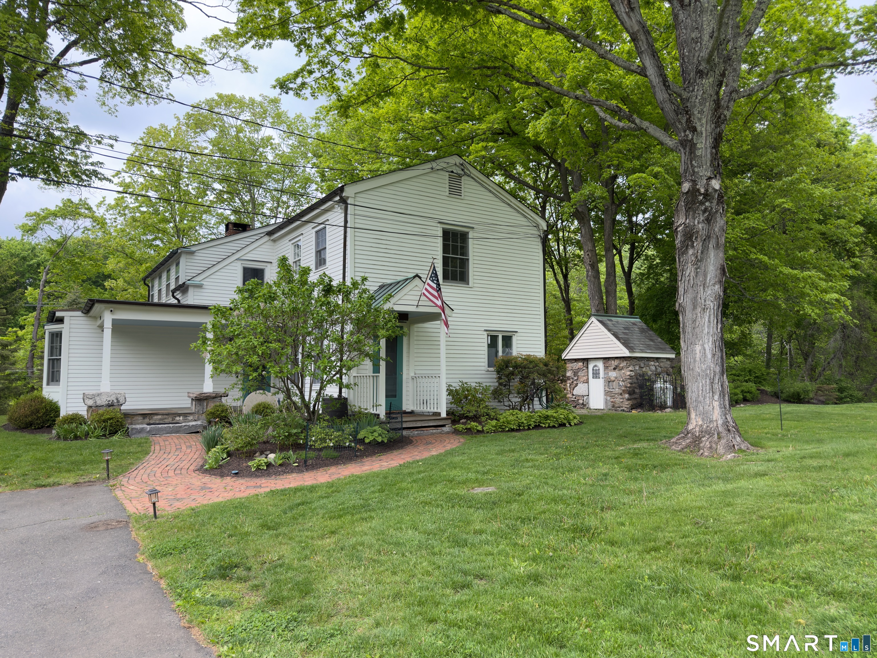 269 Farmingville Road Ridgefield, CT 06877 - Photo 2 of 17 a front view of house with yard and green space