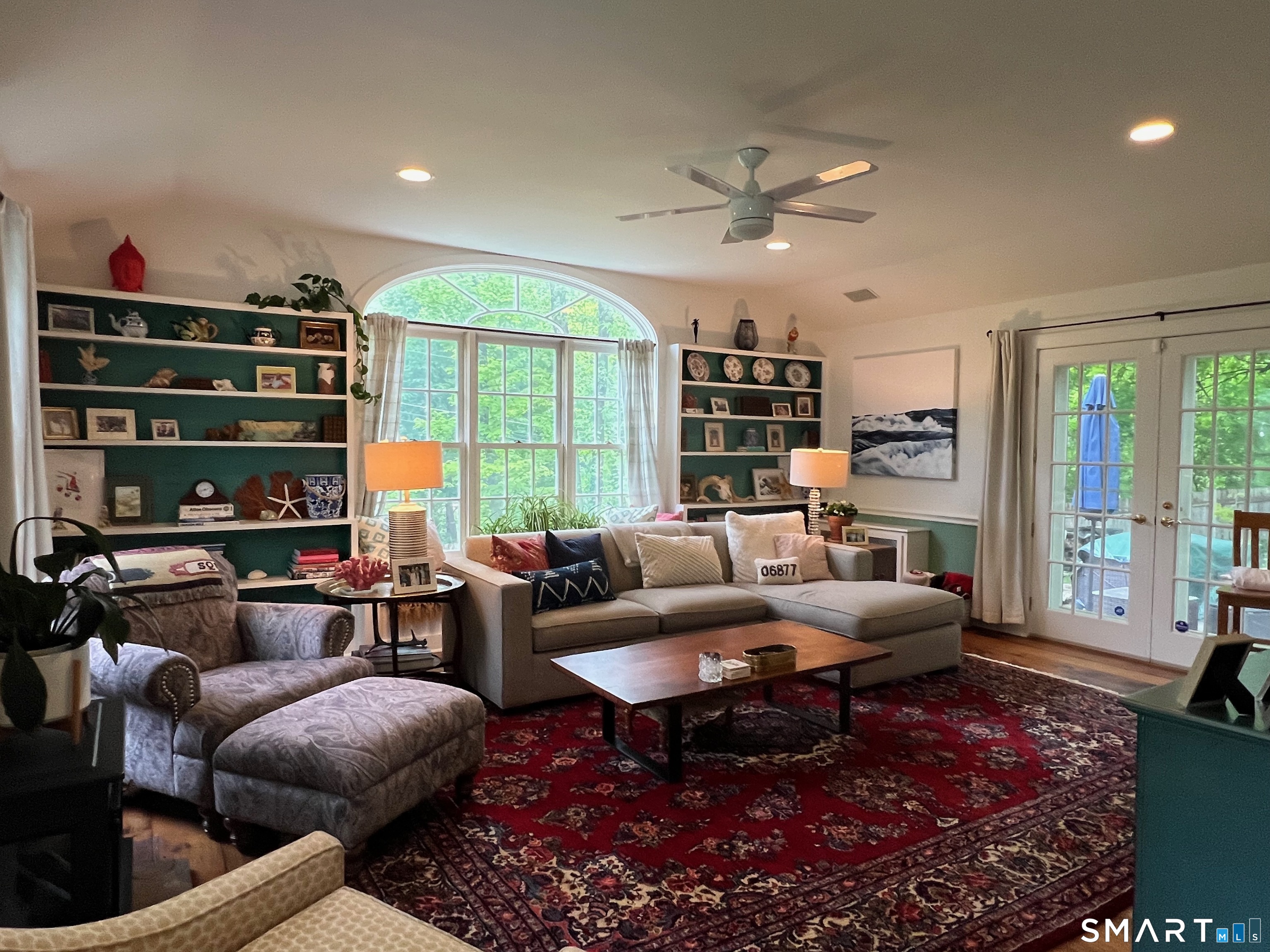 269 Farmingville Road Ridgefield, CT 06877 - Photo 9 of 17 a living room with furniture a rug and a large window