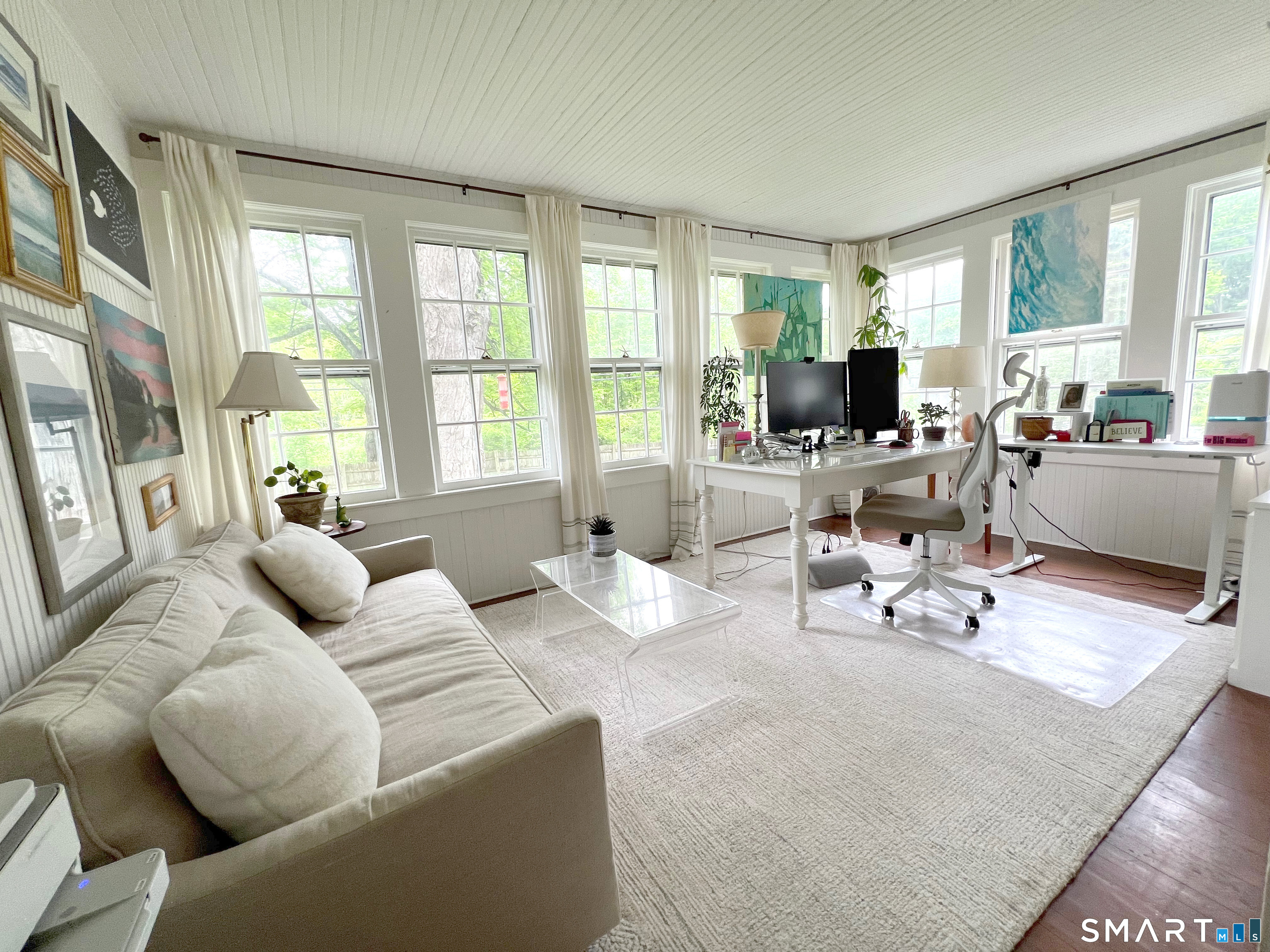 269 Farmingville Road Ridgefield, CT 06877 - Photo 10 of 17 a living room with furniture and large windows