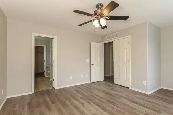 a view of a livingroom with a chandelier fan