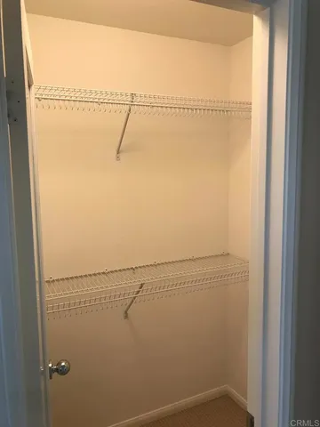 an empty room with closet area