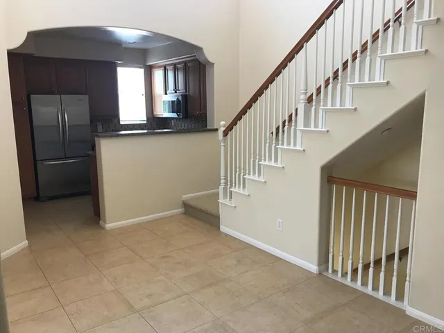 a kitchen with a sink appliances and cabinets