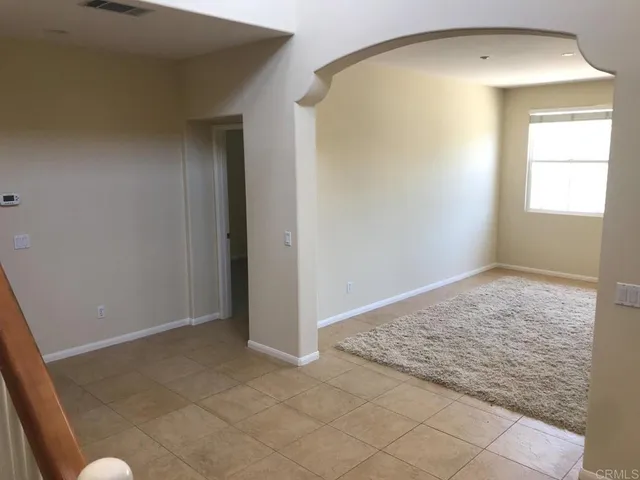 an empty room that has a window