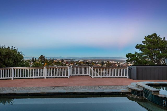 a view of a backyard with sitting area