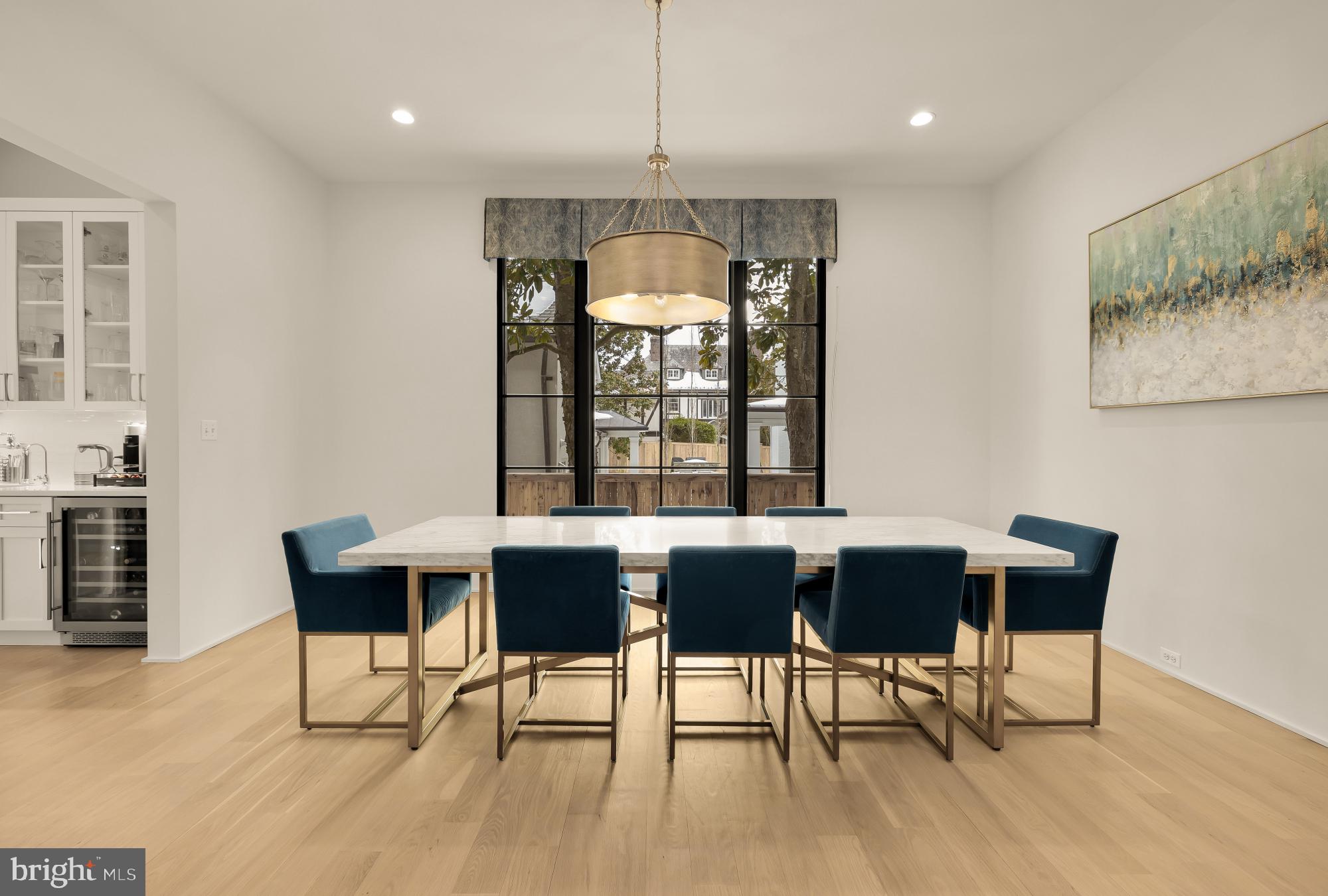 7613 Glenbrook Road Bethesda, MD 20814 - Photo 13 of 90 a view of a dining room with furniture window and wooden floor