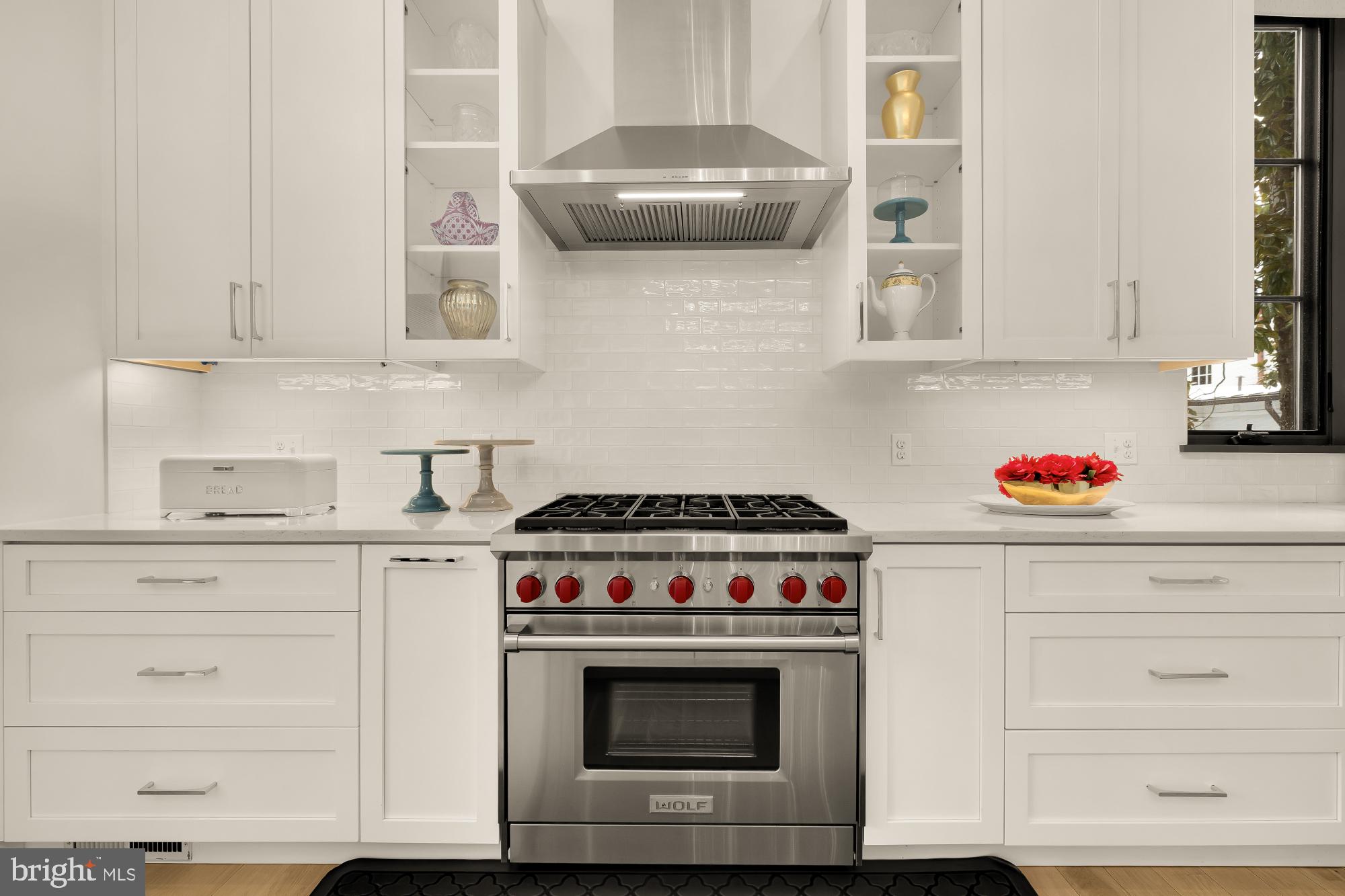 7613 Glenbrook Road Bethesda, MD 20814 - Photo 19 of 90 a stove top oven sitting inside of a kitchen