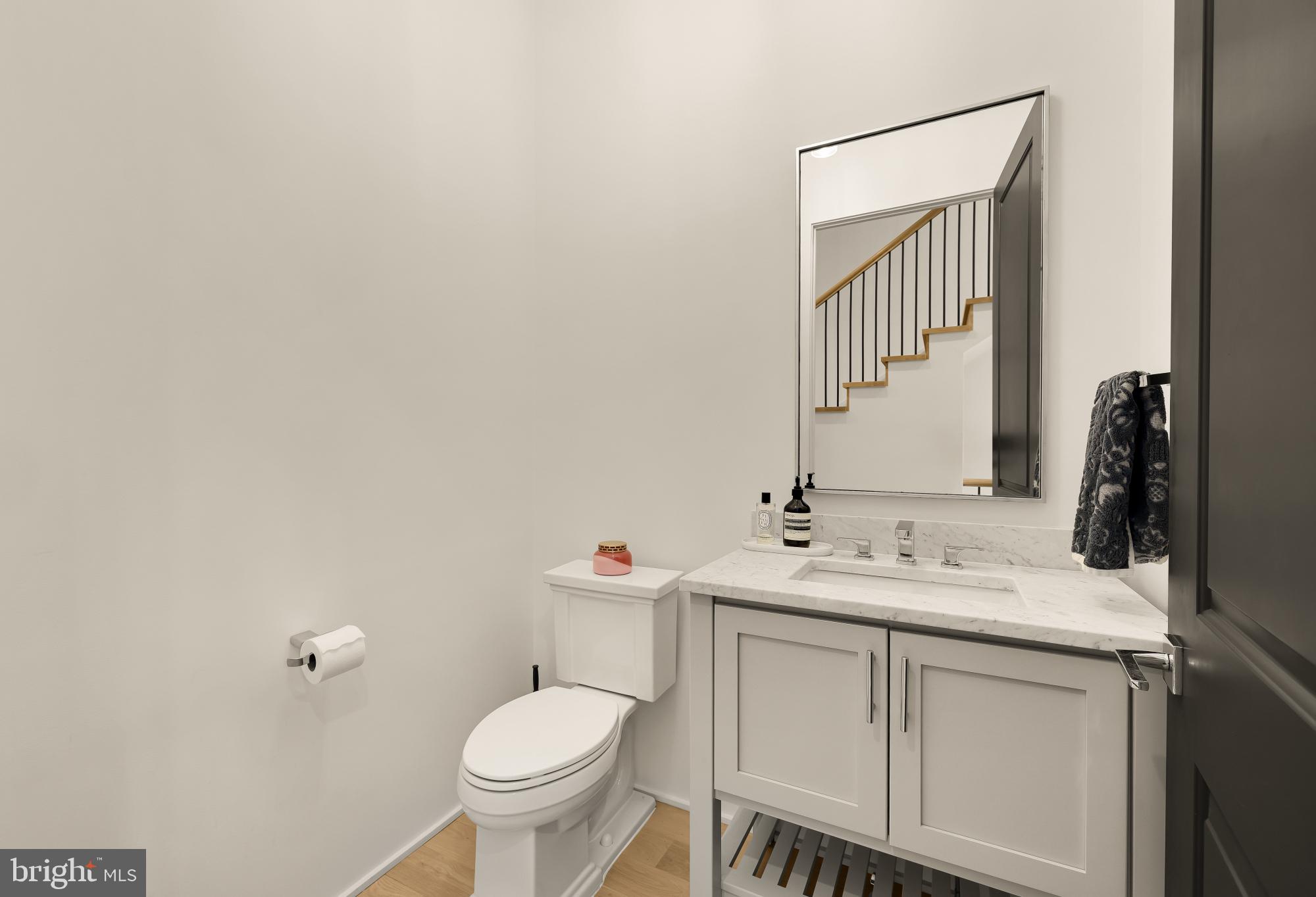 7613 Glenbrook Road Bethesda, MD 20814 - Photo 34 of 90 a bathroom with a sink toilet and mirror