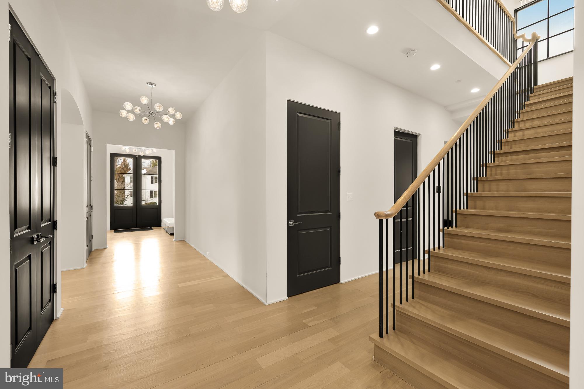 7613 Glenbrook Road Bethesda, MD 20814 - Photo 36 of 90 a view of a hallway with wooden floor and staircase