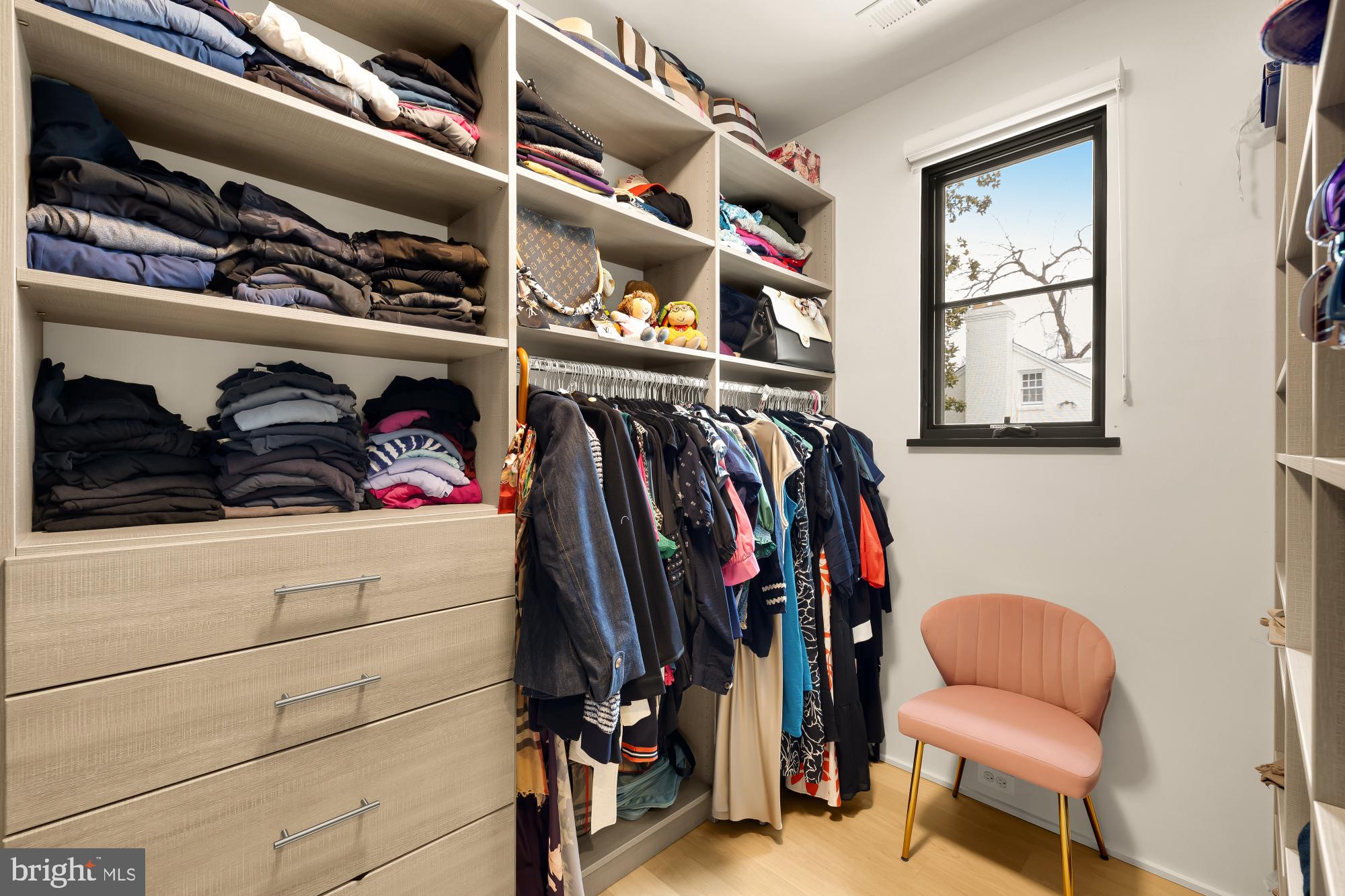 7613 Glenbrook Road Bethesda, MD 20814 - Photo 43 of 90 a view of walk in closet with clothes and shoes