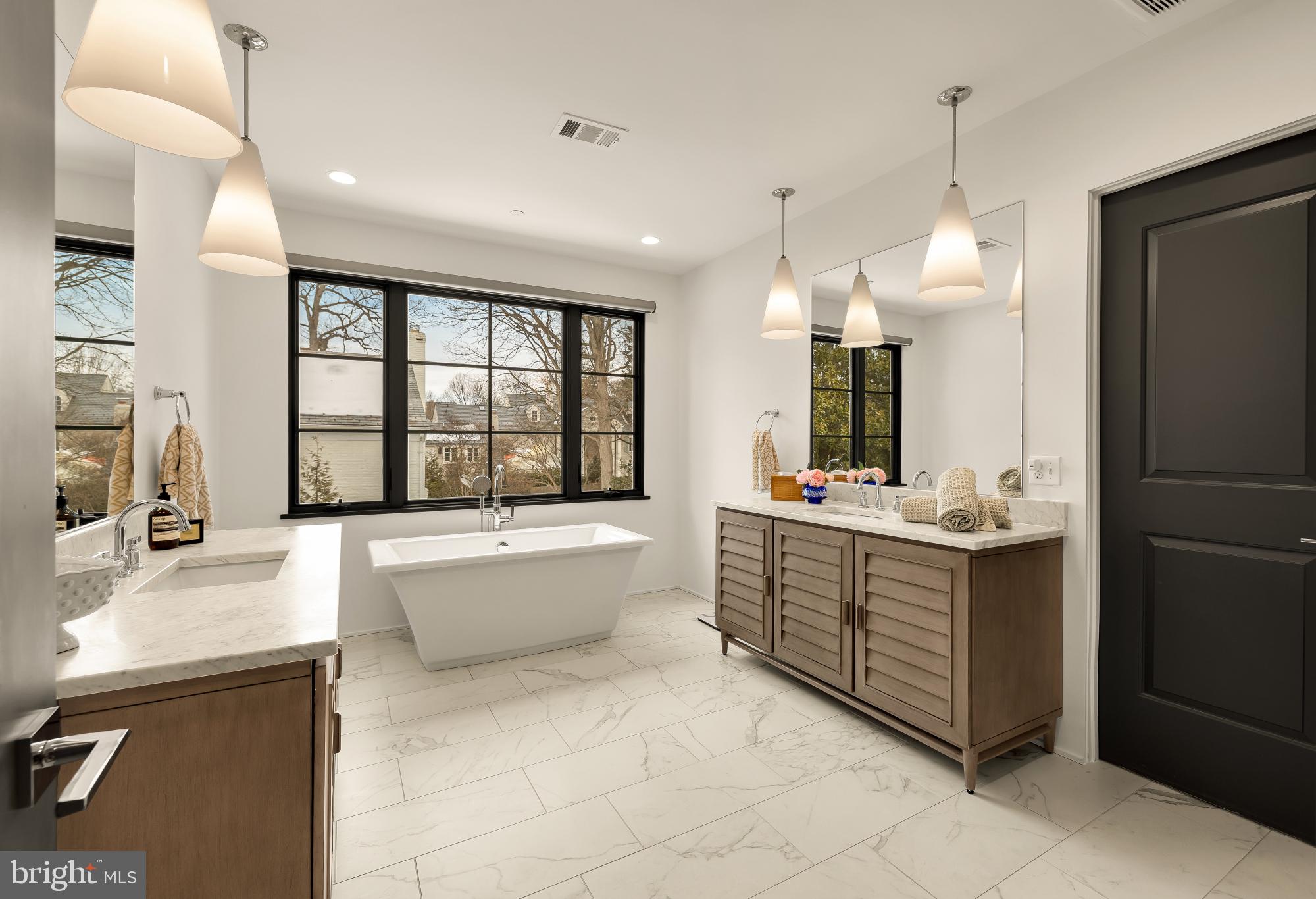 7613 Glenbrook Road Bethesda, MD 20814 - Photo 44 of 90 a large white kitchen with a large window