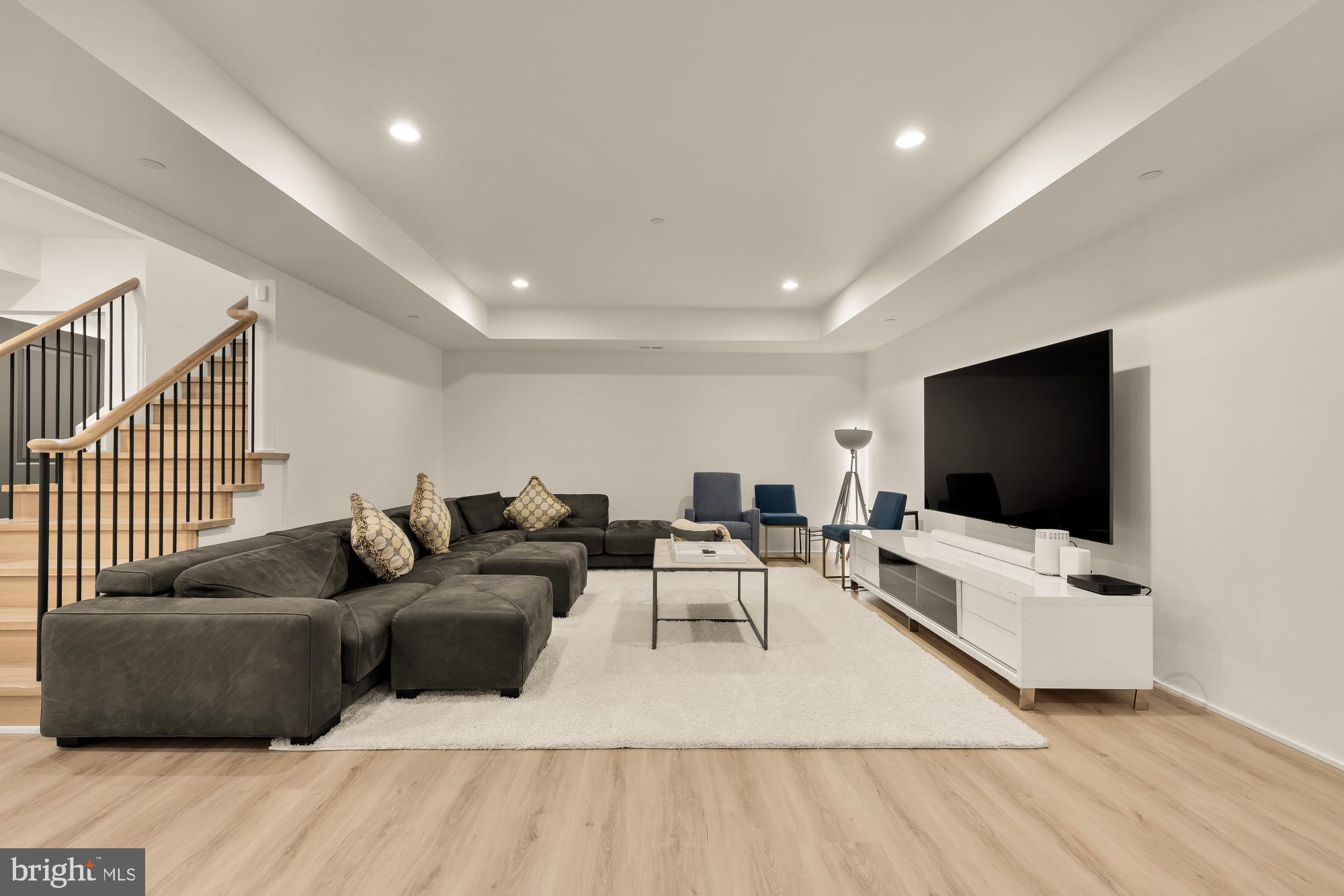 7613 Glenbrook Road Bethesda, MD 20814 - Photo 66 of 90 a living room with furniture and a flat screen tv