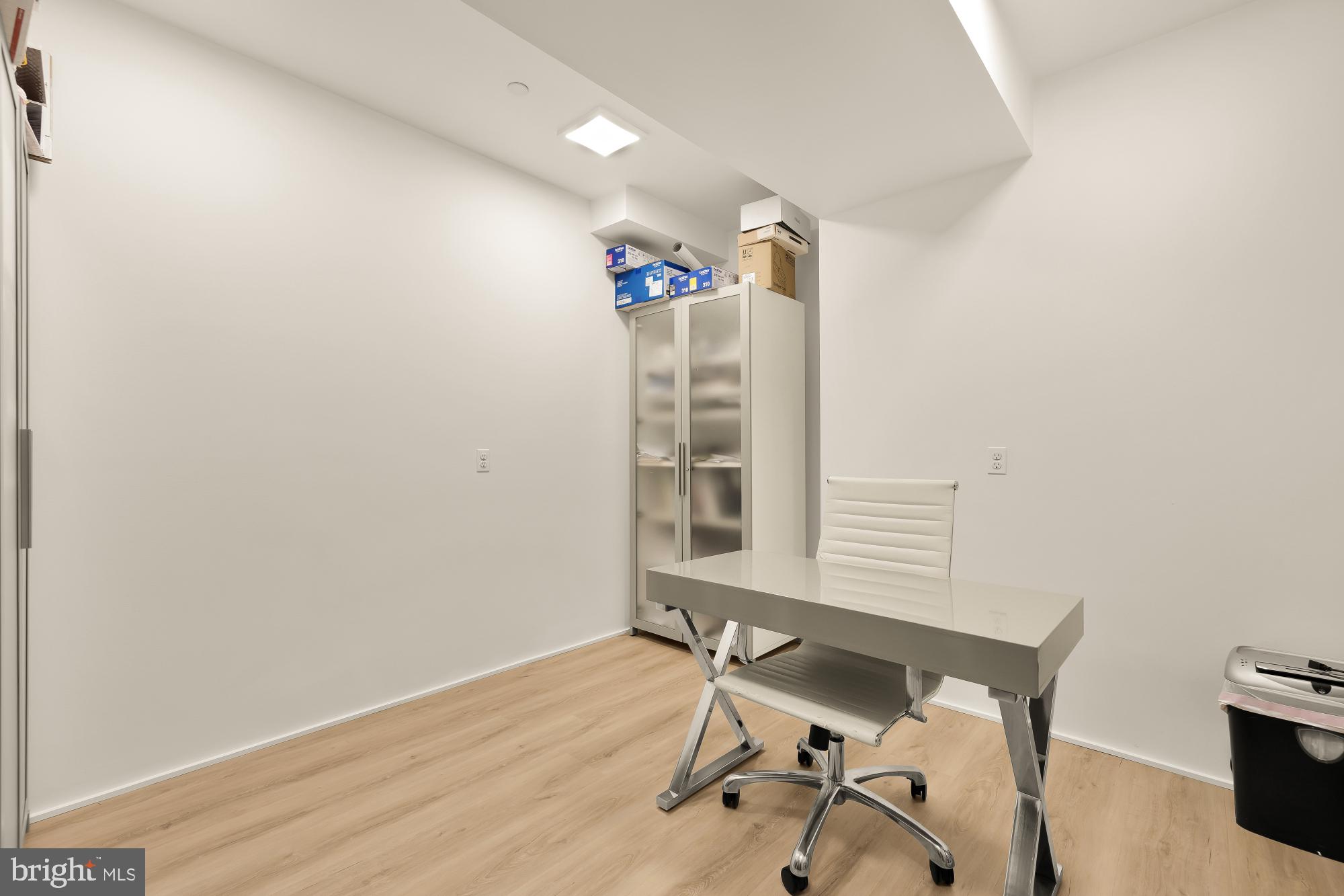 7613 Glenbrook Road Bethesda, MD 20814 - Photo 74 of 90 a view of a workspace with furniture and wooden floor