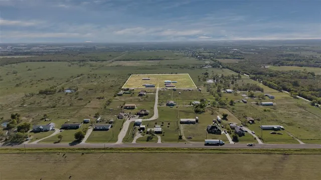an aerial view of ocean building with outdoor space