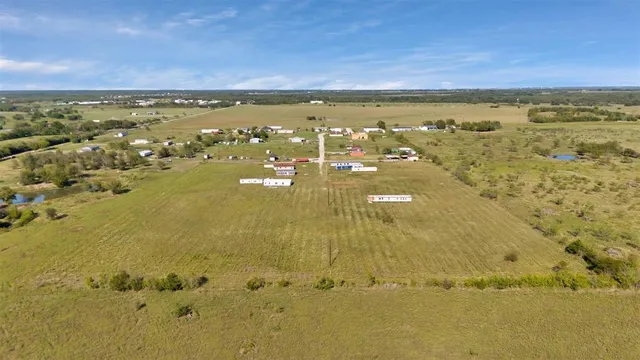 a view of a swimming pool with a yard