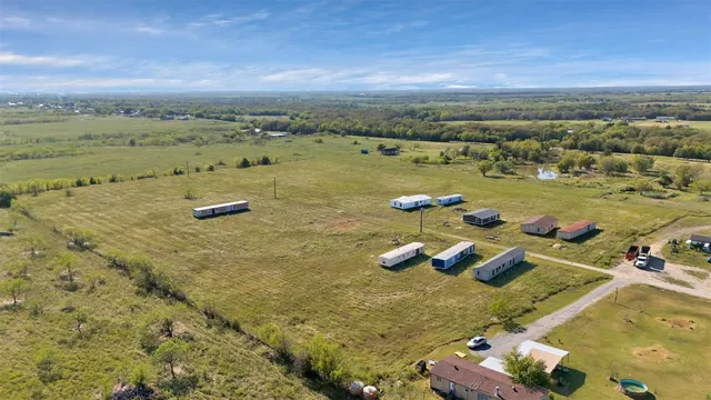 an aerial view of beach and yard