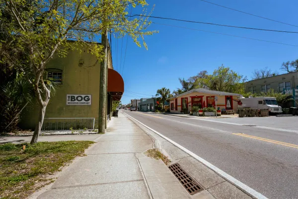 a front view of a building with parking space