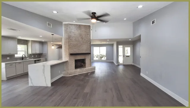 a view of a living room a fireplace with wooden floor
