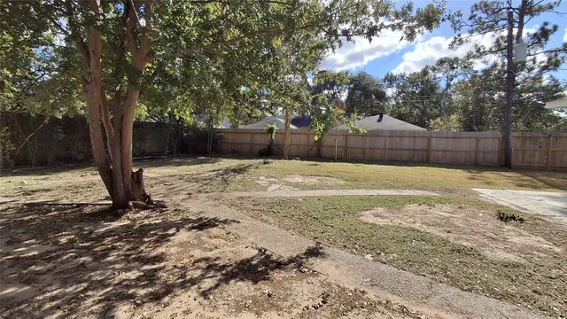 a view of backyard with sitting area