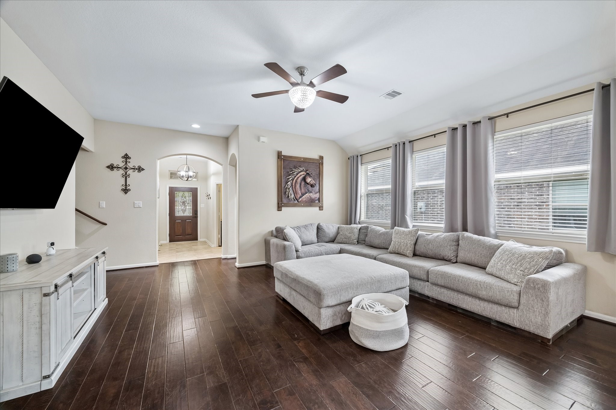 6723 Hunters Way Lane Baytown, TX 77521 - Photo 2 of 16 A stylish living room with rich dark wood flooring