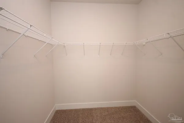 a view of a room with racks on the wall