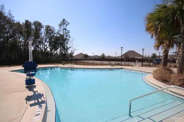 a view of outdoor space with swimming pool having outdoor seating