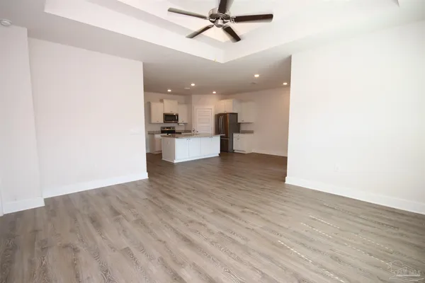 a view of a kitchen and a window