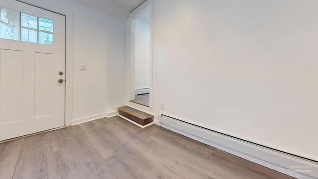 an empty room with a bench