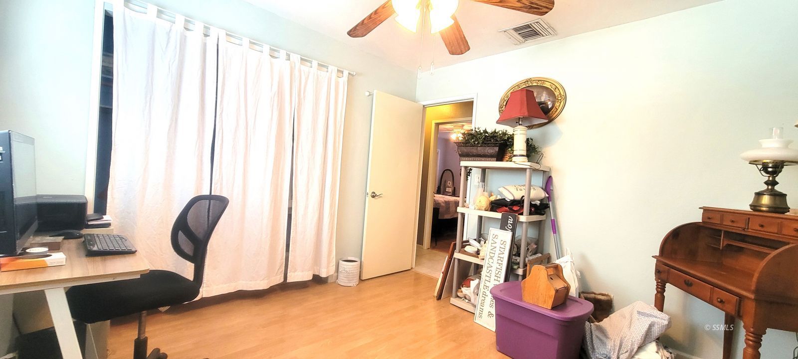 340 East Upjohn Avenue Ridgecrest, CA 93555 - Photo 19 of 31 a view of a workspace with furniture and a window