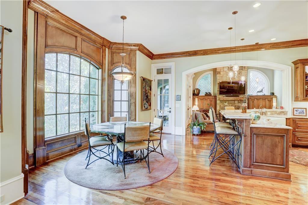 3455 Rivers Call Boulevard Atlanta, GA 30339 - Photo 17 of 53 a living room with furniture a dining table and chairs with wooden floor