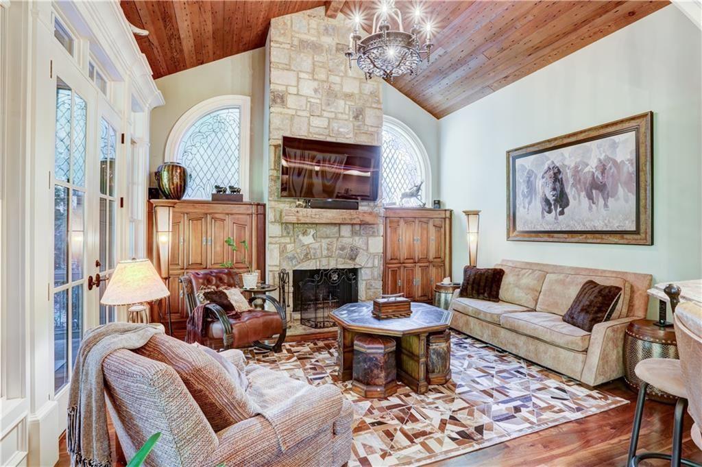 3455 Rivers Call Boulevard Atlanta, GA 30339 - Photo 20 of 53 a living room with furniture a fireplace and a chandelier