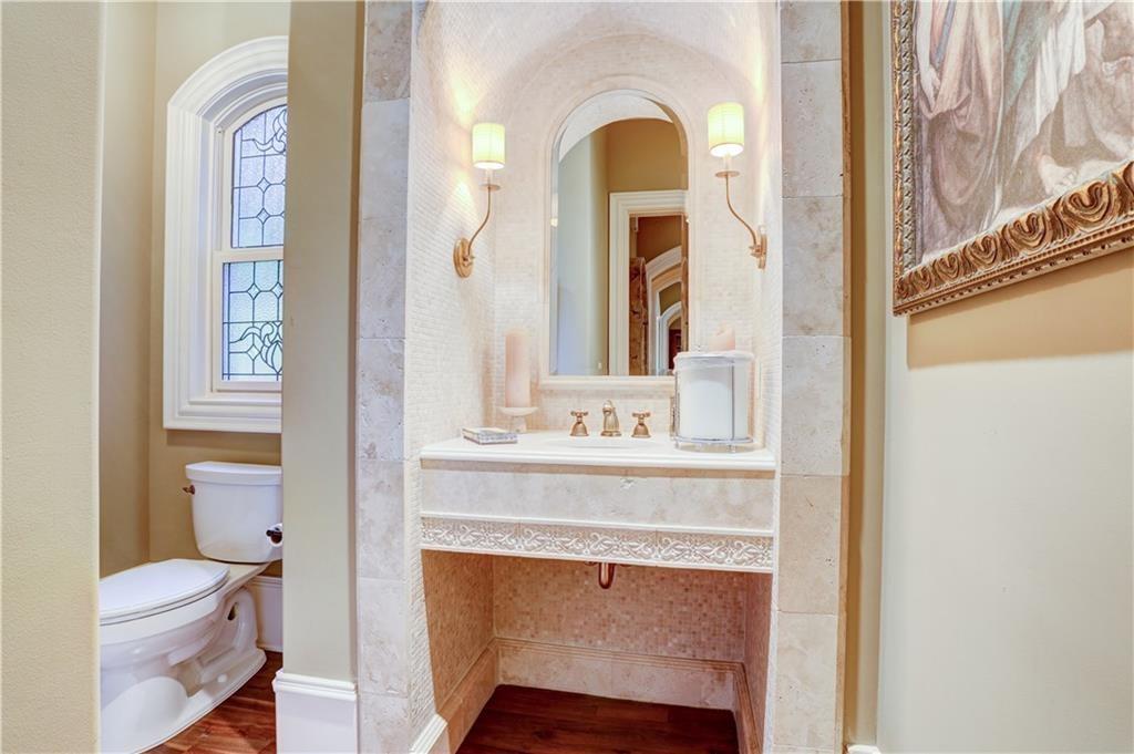 3455 Rivers Call Boulevard Atlanta, GA 30339 - Photo 27 of 53 a bathroom with a toilet a sink and a mirror