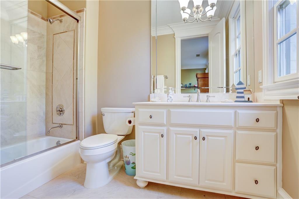 3455 Rivers Call Boulevard Atlanta, GA 30339 - Photo 45 of 53 a bathroom with a sink toilet a shower and a mirror