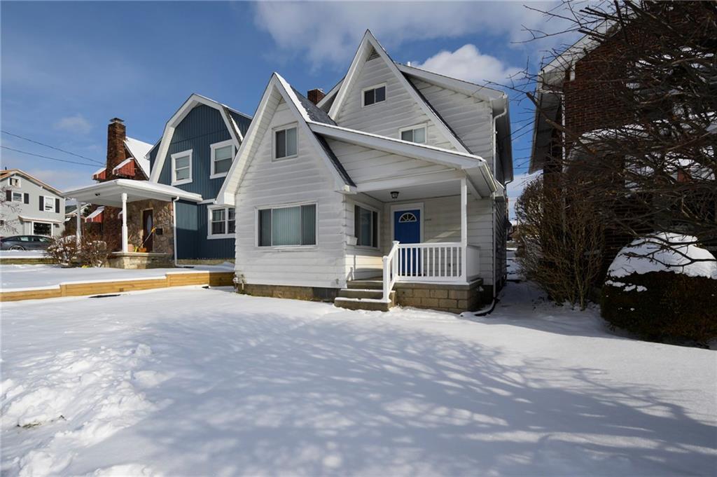 a front view of a house with swimming pool