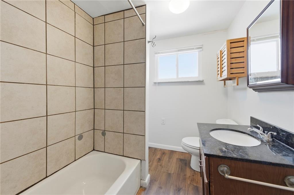 1620 Ridge Avenue New Kensington, PA 15068 - Photo 22 of 33 a bathroom with a granite countertop sink toilet and shower