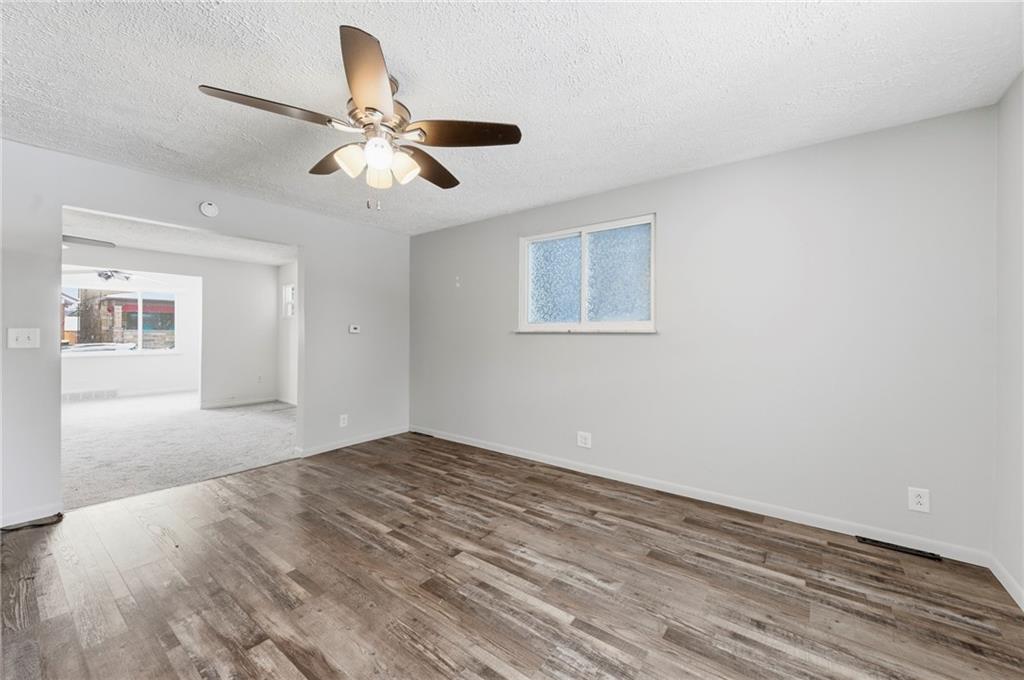 1620 Ridge Avenue New Kensington, PA 15068 - Photo 8 of 33 a view of empty room with wooden floor and ceiling fan
