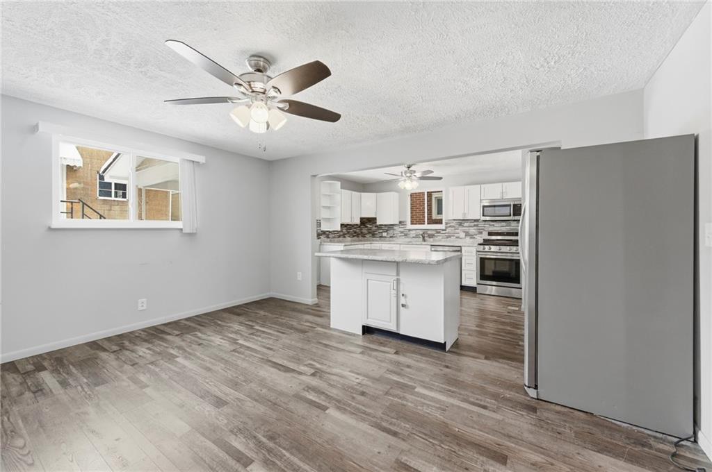 1620 Ridge Avenue New Kensington, PA 15068 - Photo 9 of 33 a view of kitchen with cabinets appliances and wooden floor