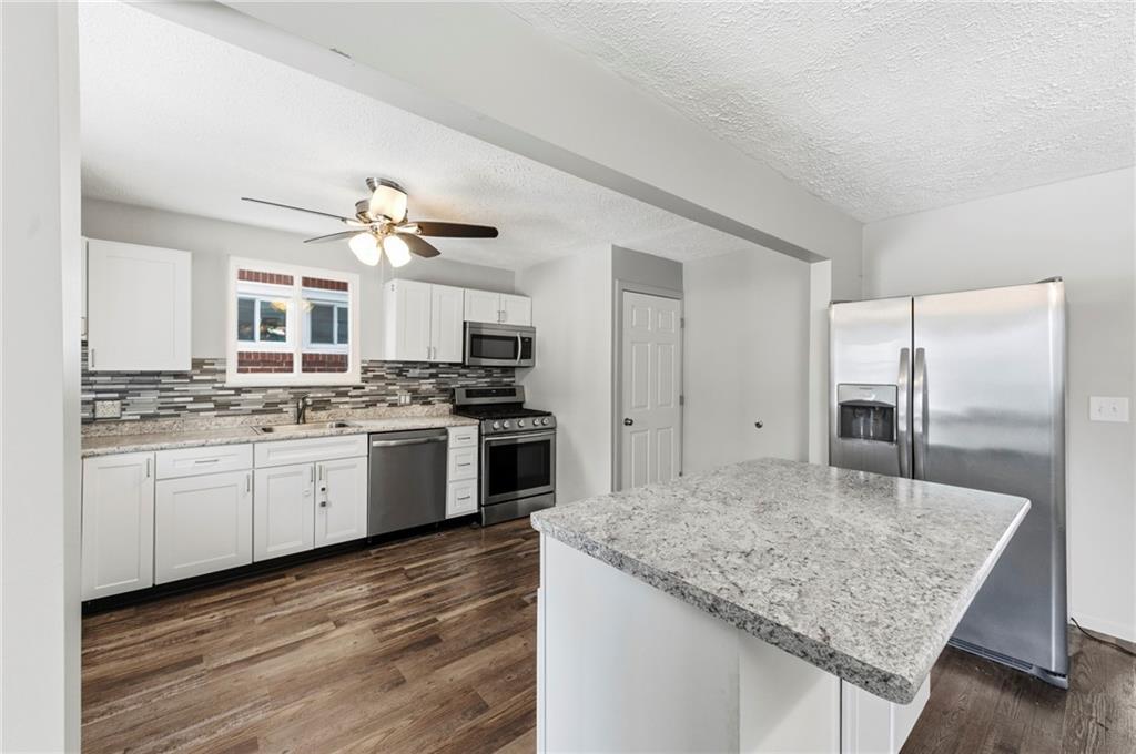 1620 Ridge Avenue New Kensington, PA 15068 - Photo 10 of 33 a kitchen with granite countertop a sink appliances cabinets and counter space
