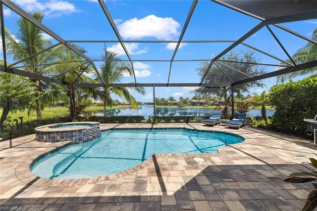 a view of a backyard with swimming pool