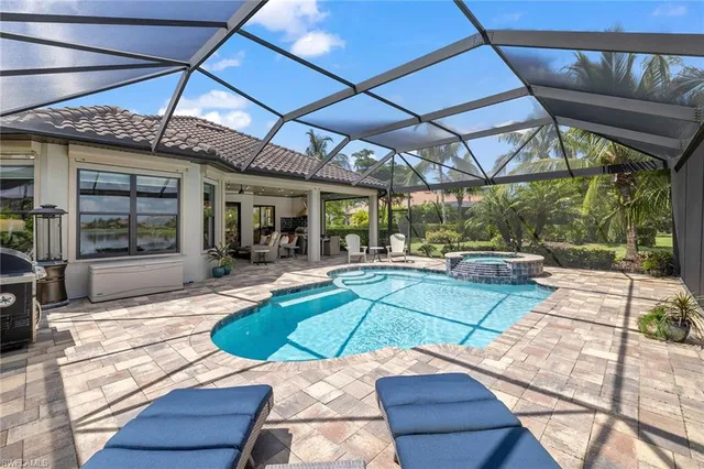 a view of a backyard with sitting area