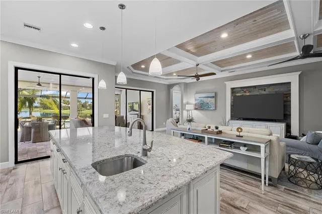 a kitchen with stainless steel appliances granite countertop a sink and a stove