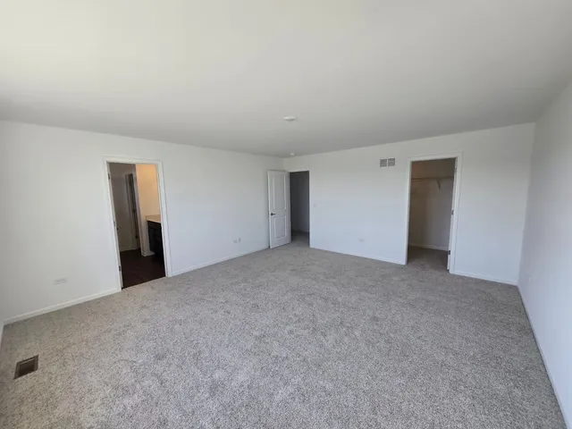 a view of an empty room and closet