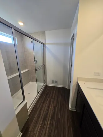 a bathroom with a sink and a shower