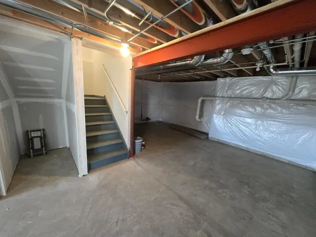 a view of an empty room with stairs